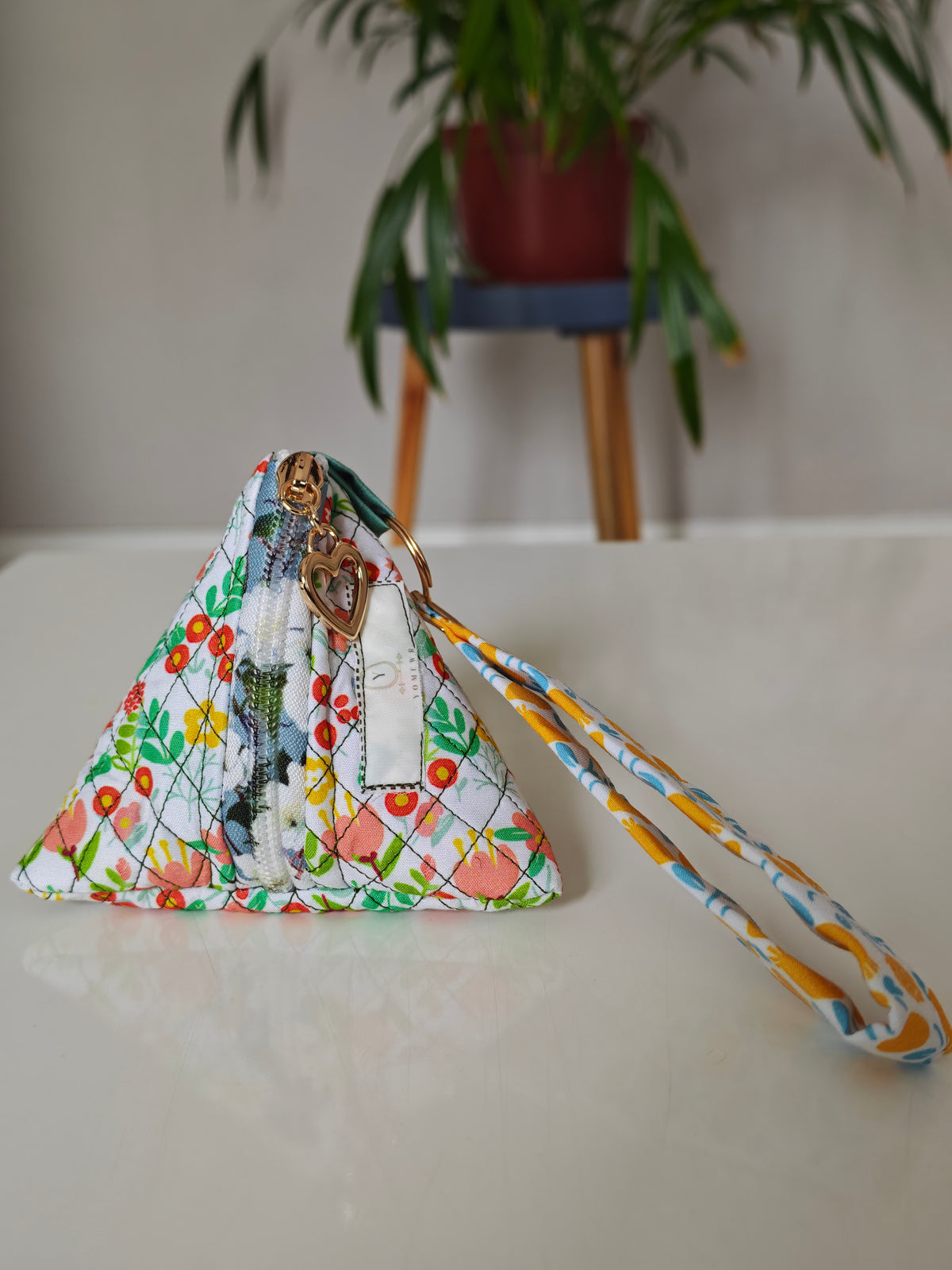 Triangular key pouch with wristlet